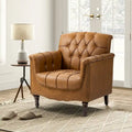 Poltrona in similpelle trapuntata con borchie e braccioli