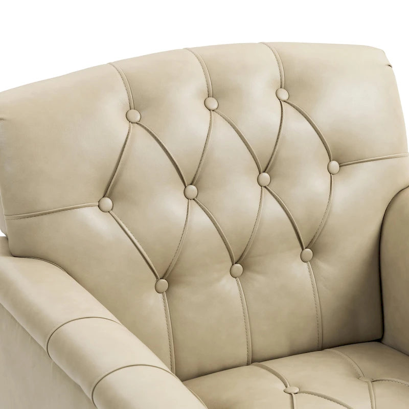 Poltrona in similpelle trapuntata con borchie e braccioli