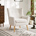 Poltrona moderna in tessuto felpato con gambe in legno